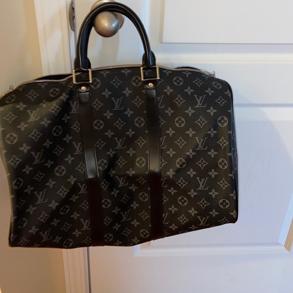 Overnight bag with L V design